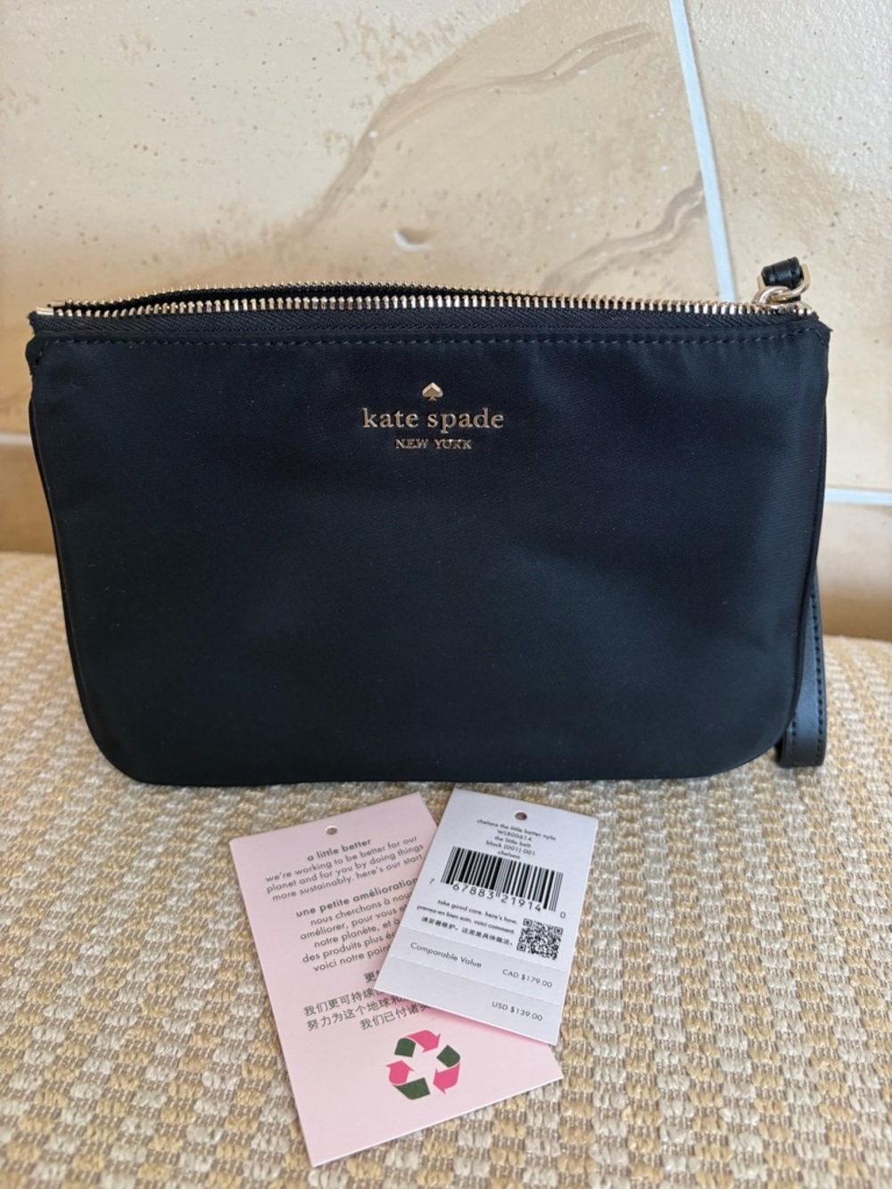kate spade black nylon wristlet with gold logo
